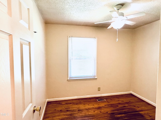 174 Carolina Dr, Reidsville, NC 27320 - spare room featuring wood finished floors, a ceiling fan, a textured ceiling, and baseboards