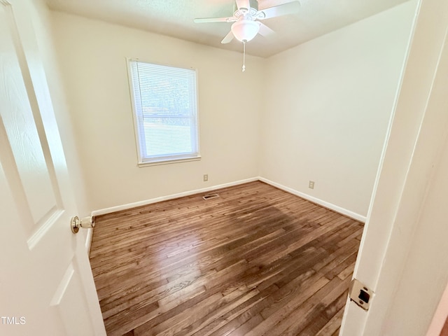 174 Carolina Dr, Reidsville, NC 27320 - unfurnished room featuring wood finished floors, ceiling fan, and baseboards