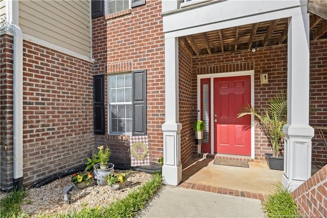 property entrance with brick siding