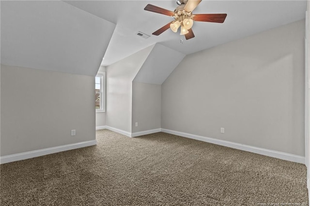 bonus room featuring carpet, lofted ceiling, baseboards, and a ceiling fan