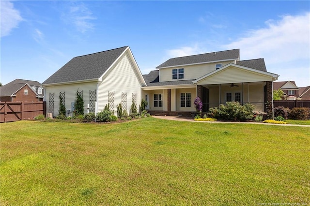 back of property featuring a ceiling fan