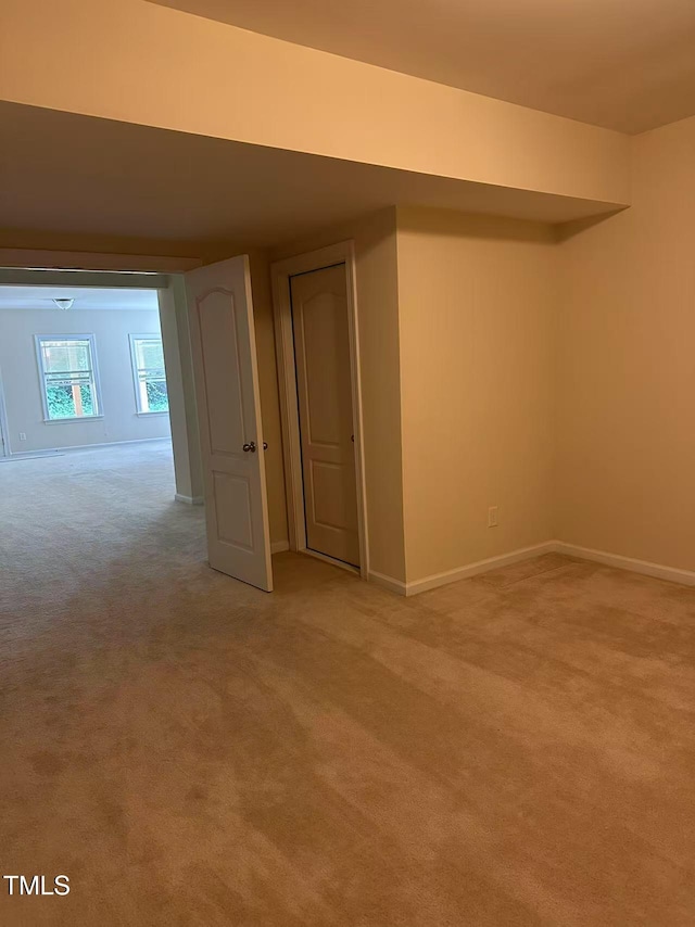 5804 Claribel Ct, Raleigh, NC 27612 - basement featuring light colored carpet and baseboards