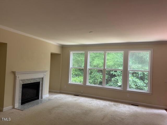 5804 Claribel Ct, Raleigh, NC 27612 - unfurnished living room featuring crown molding, carpet floors, baseboards, and a high end fireplace
