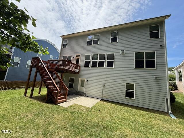 5804 Claribel Ct, Raleigh, NC 27612 - rear view of house with a wooden deck, stairs, and a patio area