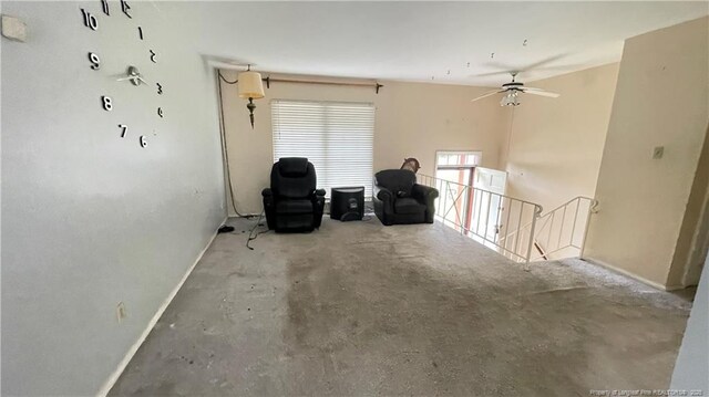 4313 Wellington Dr, Fayetteville, NC 28314 - unfurnished room with ceiling fan, baseboards, unfinished concrete flooring, and an upstairs landing