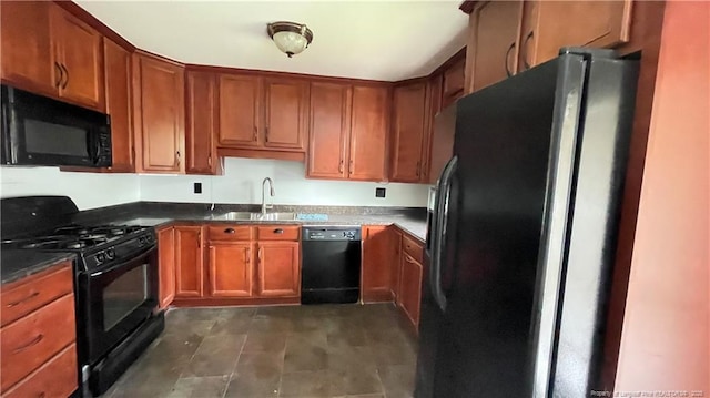 4313 Wellington Dr, Fayetteville, NC 28314 - kitchen featuring black appliances, a sink, brown cabinets, and dark countertops
