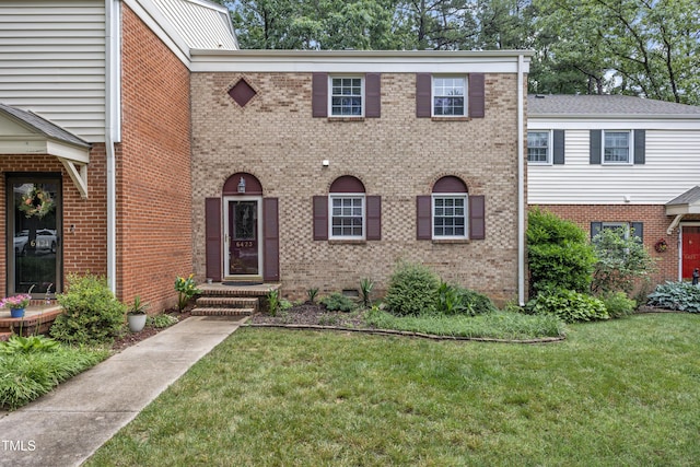 6423 New Market Way, Raleigh, NC 27615 - view of front facade featuring a front lawn and brick siding