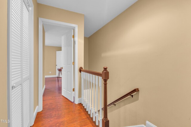 6423 New Market Way, Raleigh, NC 27615 - hall with an upstairs landing, wood finished floors, and baseboards