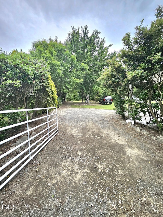 1360 Honeycutt Rd, Willow Springs, NC 27592 - view of yard featuring dirt driveway and fence