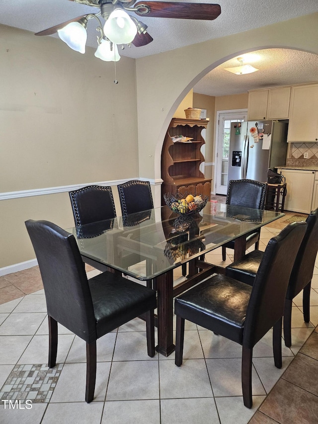 1360 Honeycutt Rd, Willow Springs, NC 27592 - dining space featuring ceiling fan, arched walkways, a textured ceiling, and light tile patterned flooring