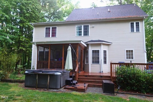 5917 Clearsprings Dr, Wake Forest, NC 27587 - rear view of house with a sunroom, a deck, and a shingled roof