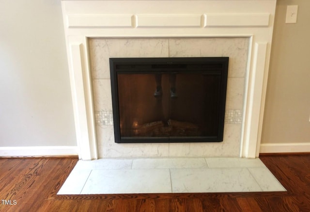 5917 Clearsprings Dr, Wake Forest, NC 27587 - detailed view of baseboards, wood finished floors, and a premium fireplace