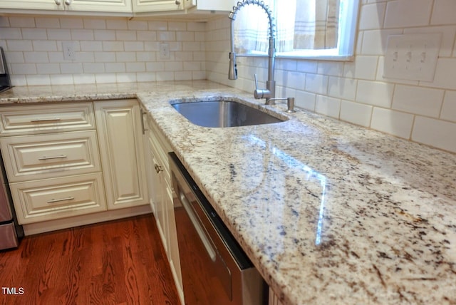 5917 Clearsprings Dr, Wake Forest, NC 27587 - kitchen featuring a sink, dishwasher, tasteful backsplash, and light stone counters