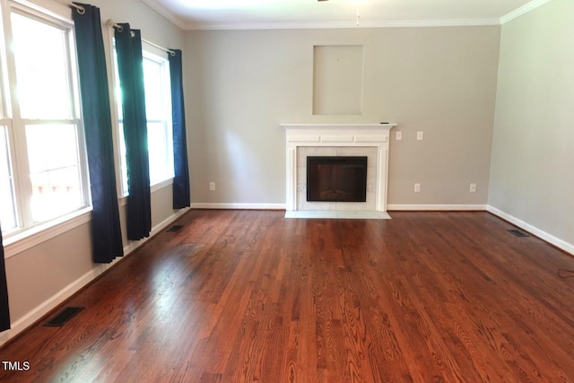 5917 Clearsprings Dr, Wake Forest, NC 27587 - unfurnished living room with ornamental molding, healthy amount of natural light, dark wood finished floors, and baseboards