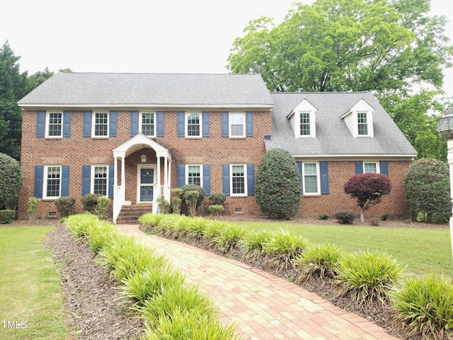 1711 Westbrook Dr NW, Wilson, NC 27896 - colonial-style house with crawl space, brick siding, and a front yard
