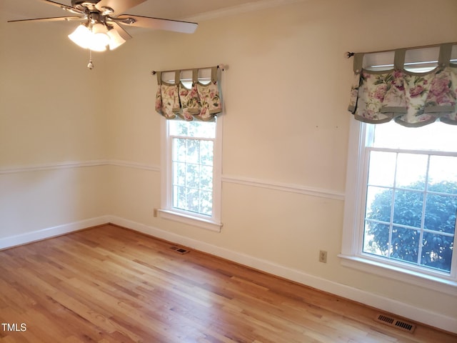 1711 Westbrook Dr NW, Wilson, NC 27896 - unfurnished dining area featuring wood finished floors, baseboards, a ceiling fan, and healthy amount of natural light