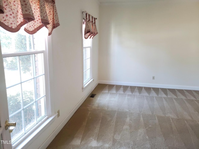 1711 Westbrook Dr NW, Wilson, NC 27896 - spare room with carpet, plenty of natural light, and baseboards