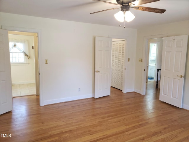 1711 Westbrook Dr NW, Wilson, NC 27896 - unfurnished bedroom featuring light wood-style floors, baseboards, and a closet