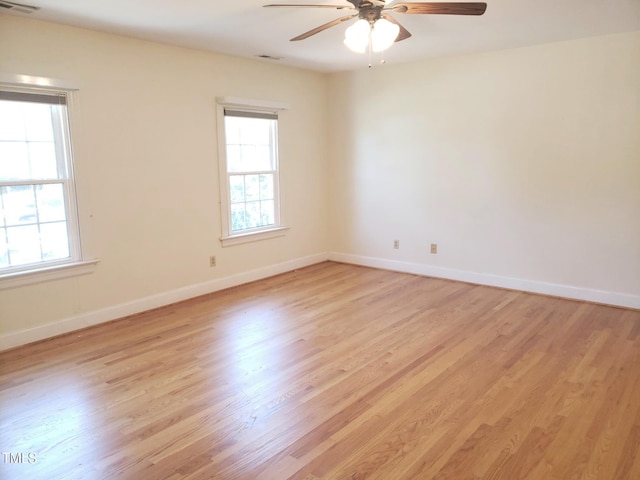 1711 Westbrook Dr NW, Wilson, NC 27896 - spare room with plenty of natural light, a ceiling fan, and light wood finished floors