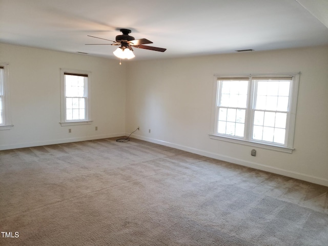 1711 Westbrook Dr NW, Wilson, NC 27896 - spare room with a ceiling fan, baseboards, and carpet