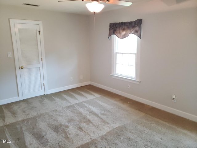 1711 Westbrook Dr NW, Wilson, NC 27896 - carpeted empty room featuring a ceiling fan and baseboards