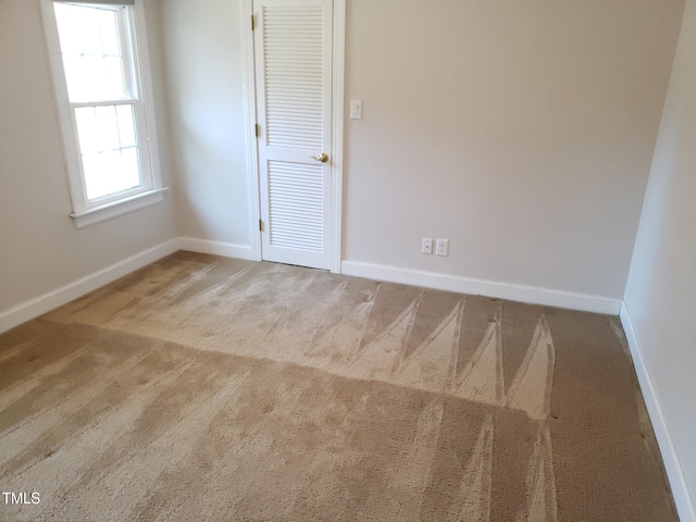 1711 Westbrook Dr NW, Wilson, NC 27896 - carpeted empty room with baseboards