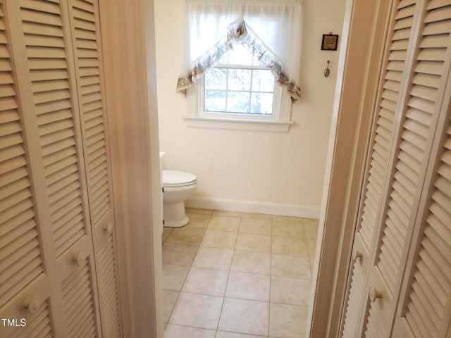 1711 Westbrook Dr NW, Wilson, NC 27896 - bathroom with a closet, toilet, tile patterned floors, and baseboards