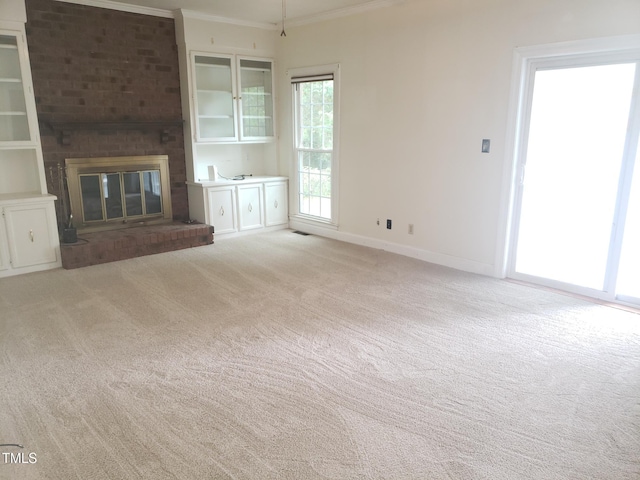1711 Westbrook Dr NW, Wilson, NC 27896 - unfurnished living room with light carpet, baseboards, a brick fireplace, and ornamental molding