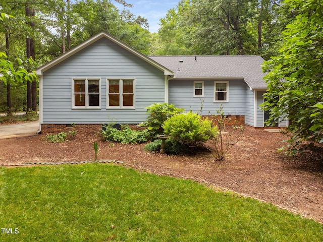 4004 Bamburgh Ln, Apex, NC 27539 - back of house with a shingled roof, a lawn, and crawl space