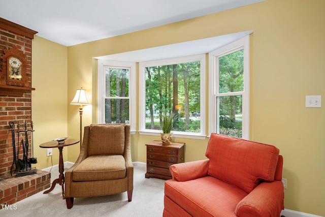 4004 Bamburgh Ln, Apex, NC 27539 - living area featuring plenty of natural light, light carpet, a brick fireplace, and baseboards