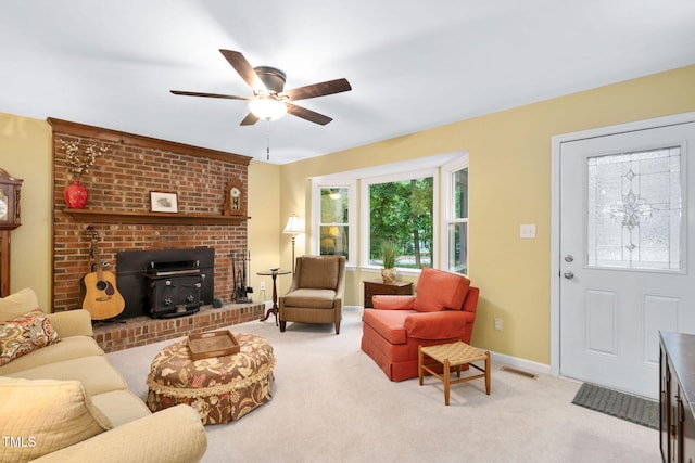 4004 Bamburgh Ln, Apex, NC 27539 - living area with a wood stove, a ceiling fan, carpet, and baseboards