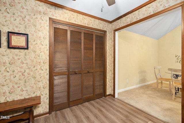 4004 Bamburgh Ln, Apex, NC 27539 - unfurnished dining area featuring wallpapered walls, baseboards, a ceiling fan, wood finished floors, and crown molding