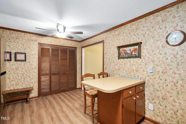 4004 Bamburgh Ln, Apex, NC 27539 - kitchen with a ceiling fan, light wood-type flooring, wallpapered walls, light countertops, and a kitchen breakfast bar