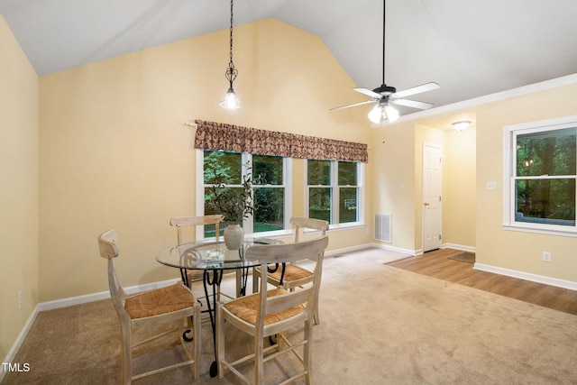 4004 Bamburgh Ln, Apex, NC 27539 - carpeted dining area featuring plenty of natural light, ceiling fan, baseboards, and high vaulted ceiling