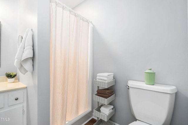 4004 Bamburgh Ln, Apex, NC 27539 - bathroom featuring toilet, vanity, wood finished floors, and a shower with shower curtain