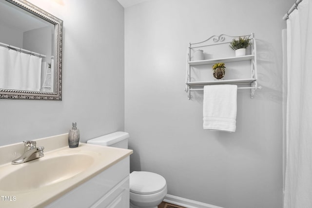 4004 Bamburgh Ln, Apex, NC 27539 - bathroom featuring vanity and toilet