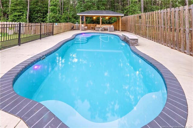 3015 Morning Dew Ln, Fayetteville, NC 28306 - view of pool with a fenced backyard, an outdoor living space, a patio, and a gazebo
