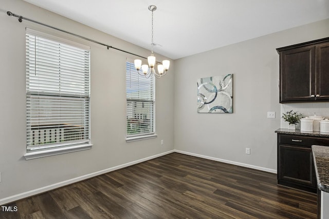 810 Richmont Grove Ln, Apex, NC 27523 - unfurnished dining area featuring a chandelier and dark wood-style flooring