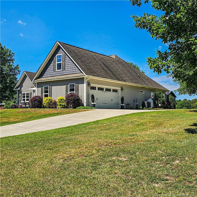 1303 Palestine Rd, Linden, NC 28356 - view of front of property with board and batten siding, an attached garage, driveway, and a front yard