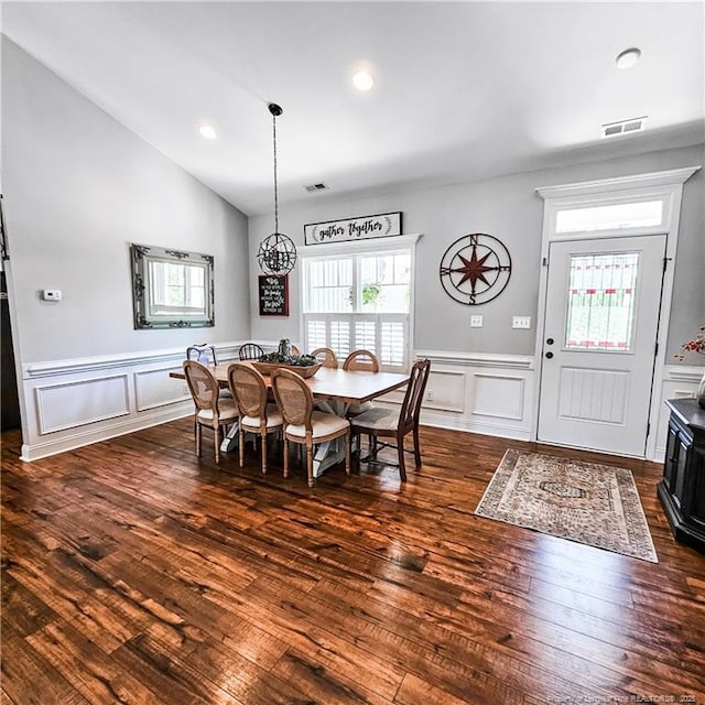 1303 Palestine Rd, Linden, NC 28356 - dining room featuring a decorative wall, wainscoting, dark wood-type flooring, a chandelier, and vaulted ceiling