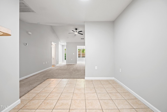 11220 Avocet Ln Unit 104, Raleigh, NC 27617 - spare room featuring a ceiling fan, light carpet, baseboards, and lofted ceiling