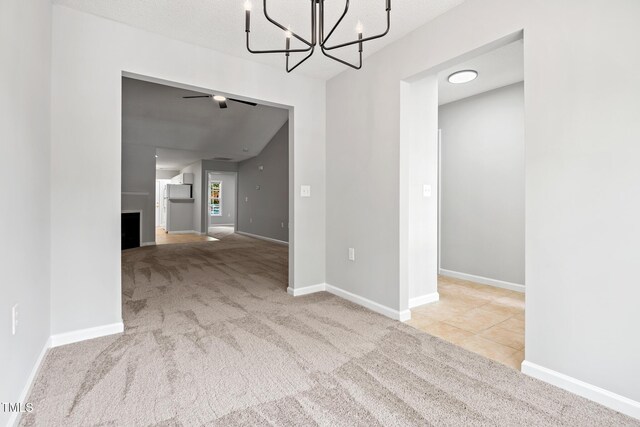 11220 Avocet Ln Unit 104, Raleigh, NC 27617 - carpeted empty room featuring a chandelier and baseboards
