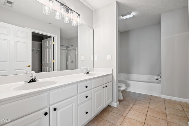 11220 Avocet Ln Unit 104, Raleigh, NC 27617 - full bathroom featuring tile patterned flooring, a shower stall, double vanity, toilet, and a garden tub