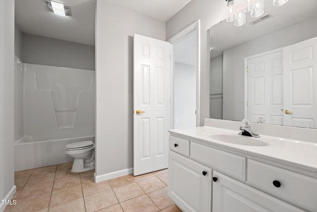 11220 Avocet Ln Unit 104, Raleigh, NC 27617 - bathroom featuring tile patterned flooring, vanity, baseboards, toilet, and  shower combination