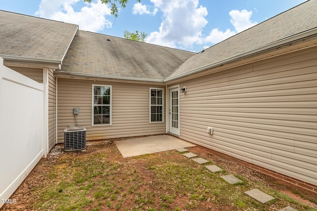 11220 Avocet Ln Unit 104, Raleigh, NC 27617 - rear view of property with central AC, a patio, and a shingled roof