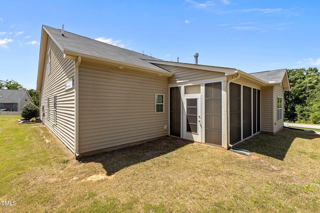 39 Mcguire Ln, Clayton, NC 27527 - back of house featuring a sunroom and a lawn