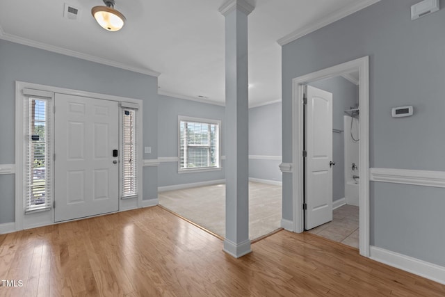39 Mcguire Ln, Clayton, NC 27527 - foyer entrance with crown molding, wood finished floors, baseboards, and ornate columns