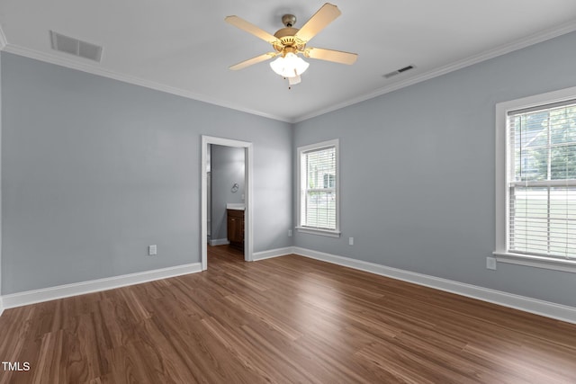 39 Mcguire Ln, Clayton, NC 27527 - spare room with dark wood-type flooring, baseboards, ornamental molding, and ceiling fan