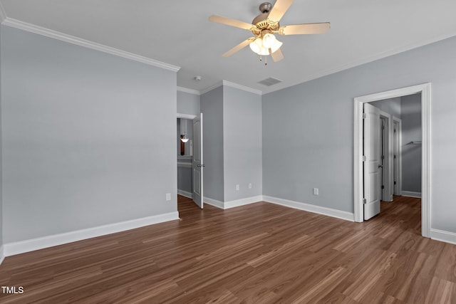 39 Mcguire Ln, Clayton, NC 27527 - unfurnished bedroom featuring wood finished floors, baseboards, ornamental molding, a walk in closet, and ceiling fan