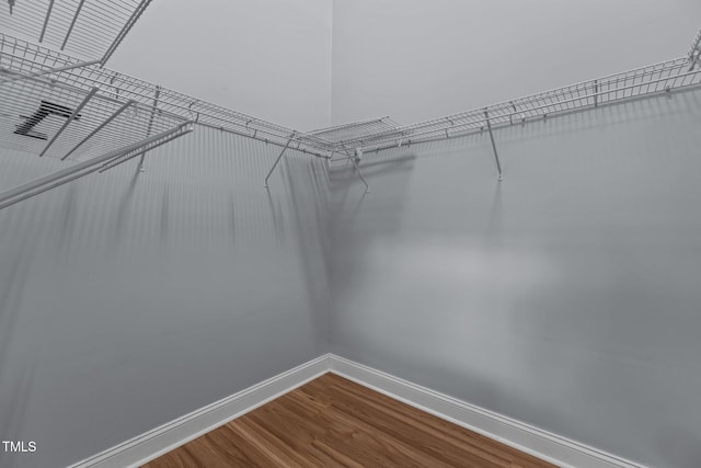 39 Mcguire Ln, Clayton, NC 27527 - walk in closet with dark wood-style floors